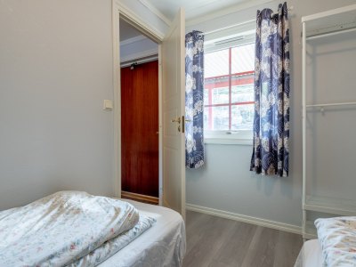 Bedroom with twin beds and window.