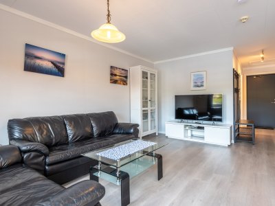Living room with sofa and TV.