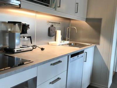 Kitchen with oven, stove, and sink.