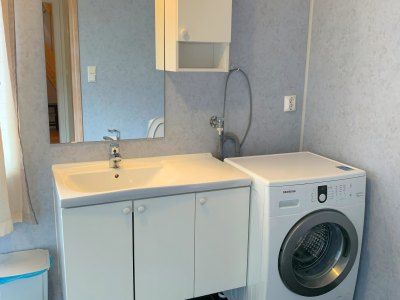 Bathroom with sink and washing machine.