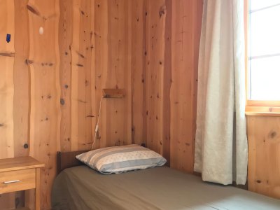 Bedroom with single bed and window.