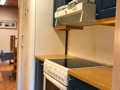Apartment Type 3 kitchen with oven, stove, and fridge – Sotra Rorbusenter