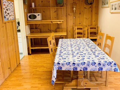 Living room dining area with table and chairs.