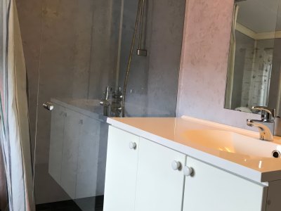 Bathroom with shower and sink.