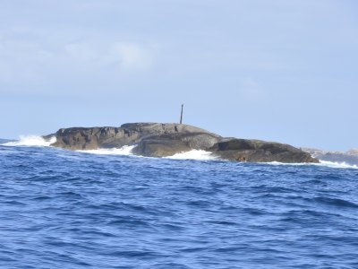 Small rocky island in the sea near Sotra.