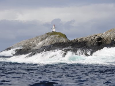 Lighthouse on a rocky island off the Sotra coast.