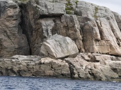 Rocky cliffs along the Sotra coastline in Norway.