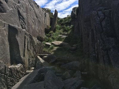 Rock formations along a mountain hiking trail in Sotra.