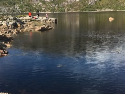 Mountain lake with reflections in Sotra.