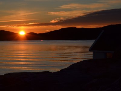 Orange sunset over the sea in Sotra.