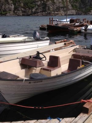 Rental motorboat for fishing at harbor.