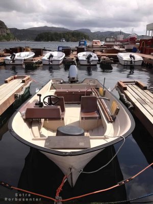Rental motorboat with seating for fishing.