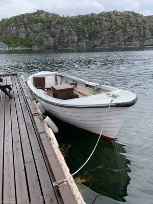 Traditional wooden motorboat for fishing rental.