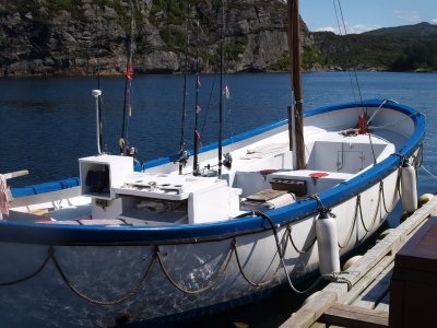 Traditional open-deck motorboat rental.