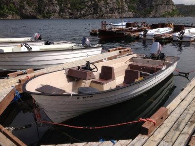 Rental motorboat with seating for fishing.
